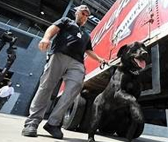 canine patrolling semi-truck