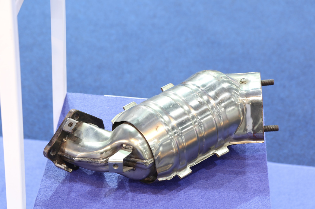 a close up of a metal object on a blue surface